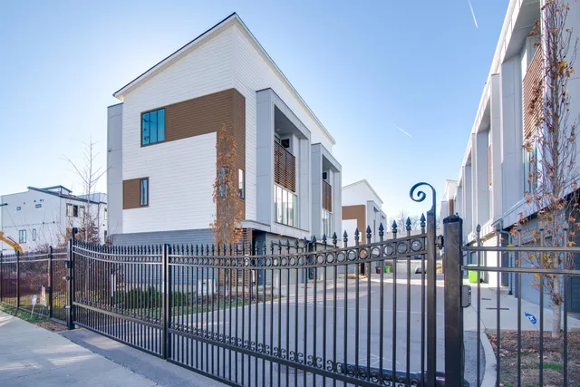 a view of a brick building with many windows
