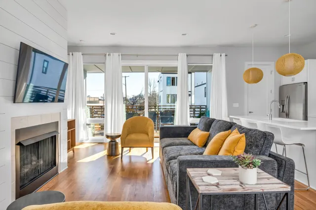 a living room with furniture and a fireplace