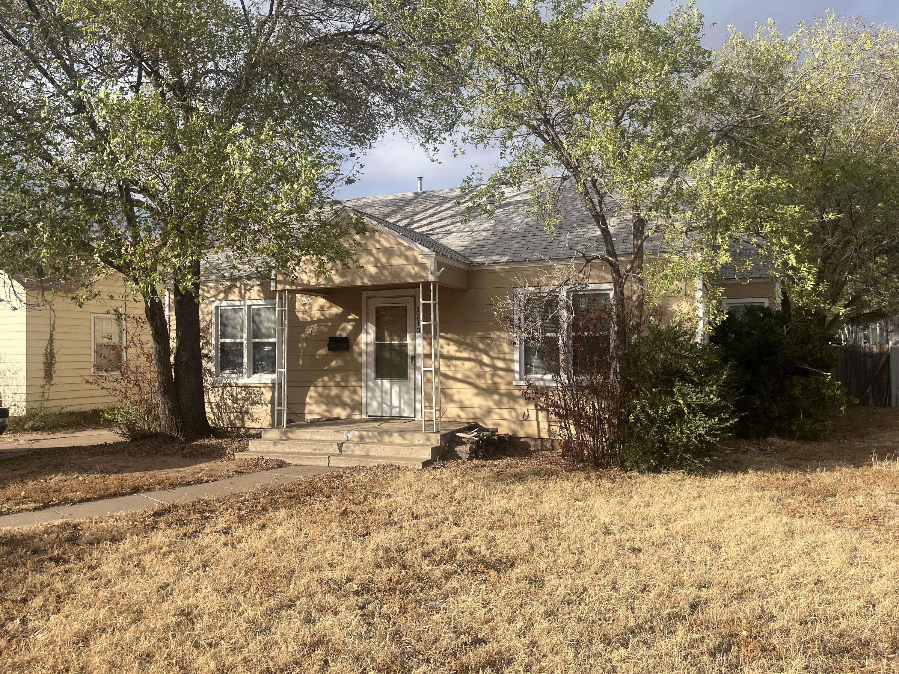 2210 26th Street Lubbock, TX 79411 - Photo 2 of 2 a view of a house with a yard covered in snow
