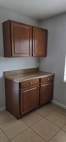 a stove top oven sitting inside of a kitchen