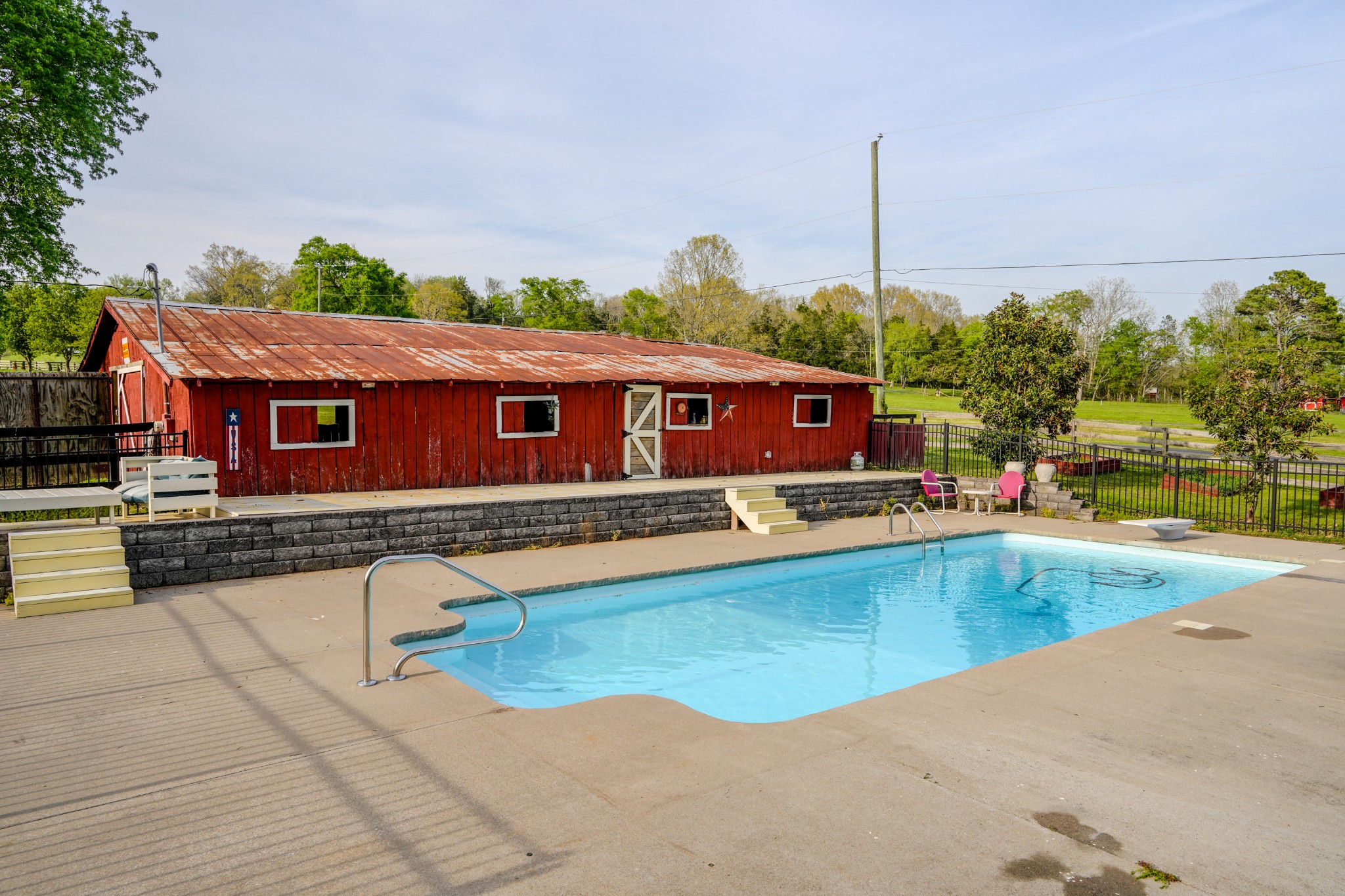 1199 Willis Branch Road Goodlettsville, TN 37072 - Photo 34 of 95 a view of a swimming pool with a chairs
