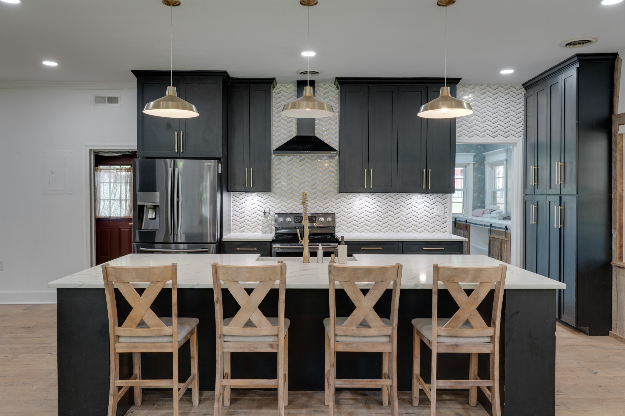 1199 Willis Branch Road Goodlettsville, TN 37072 - Photo 45 of 95 a kitchen with a dining table chairs cabinets and stainless steel appliances
