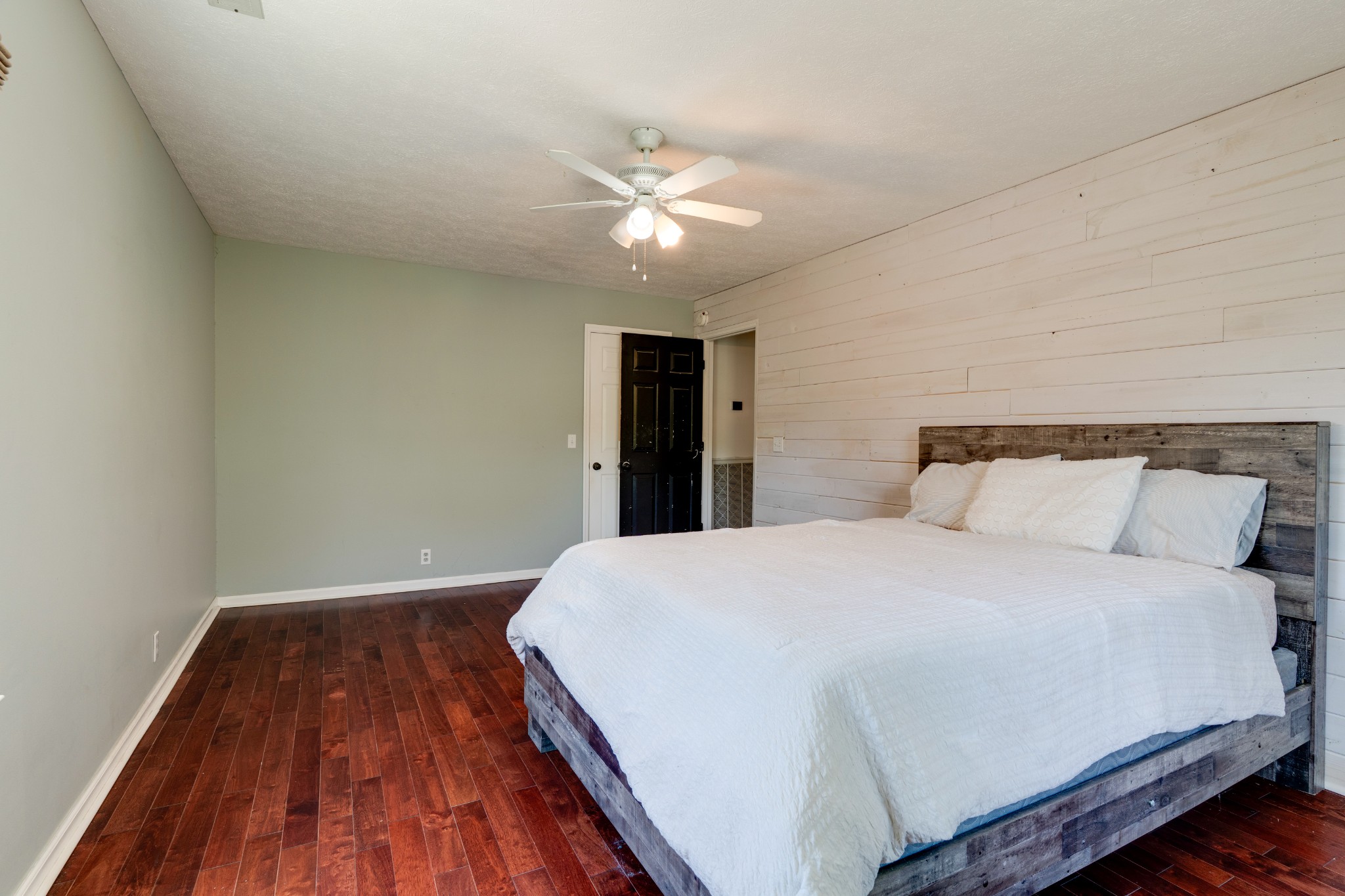 1199 Willis Branch Road Goodlettsville, TN 37072 - Photo 64 of 95 a bedroom with a large bed and a chandelier