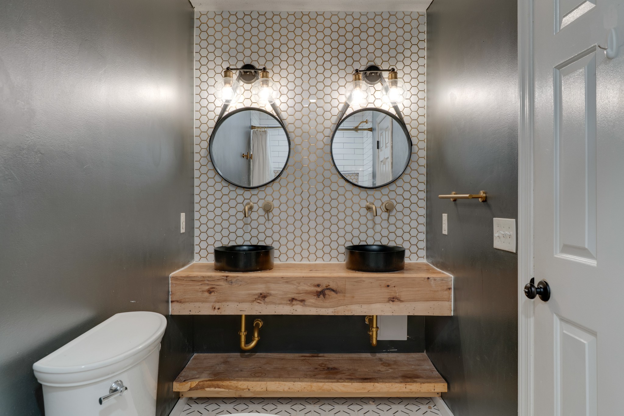 1199 Willis Branch Road Goodlettsville, TN 37072 - Photo 66 of 95 a bathroom with a toilet and a mirror