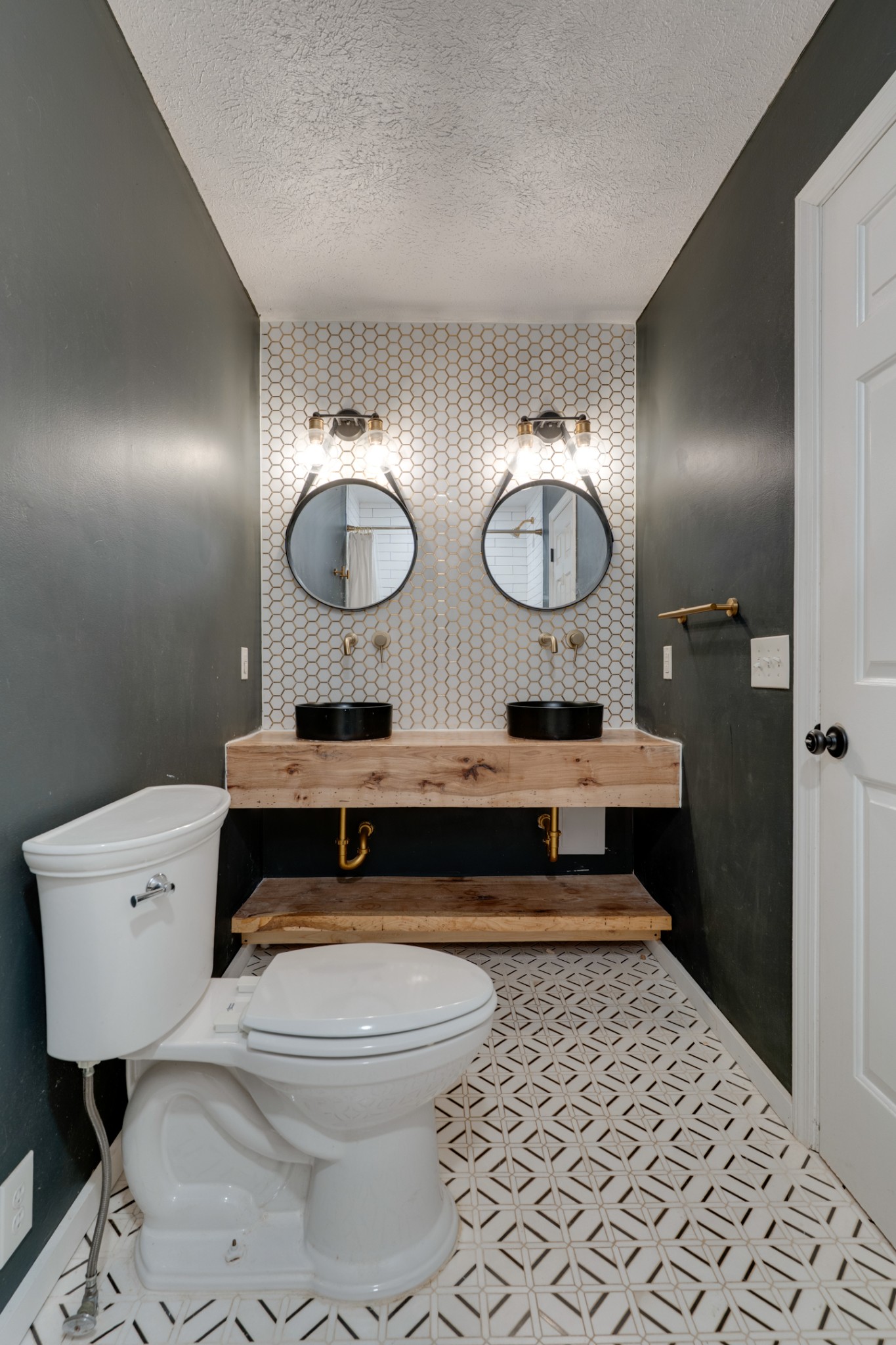 1199 Willis Branch Road Goodlettsville, TN 37072 - Photo 67 of 95 a bathroom with a toilet a sink and mirror