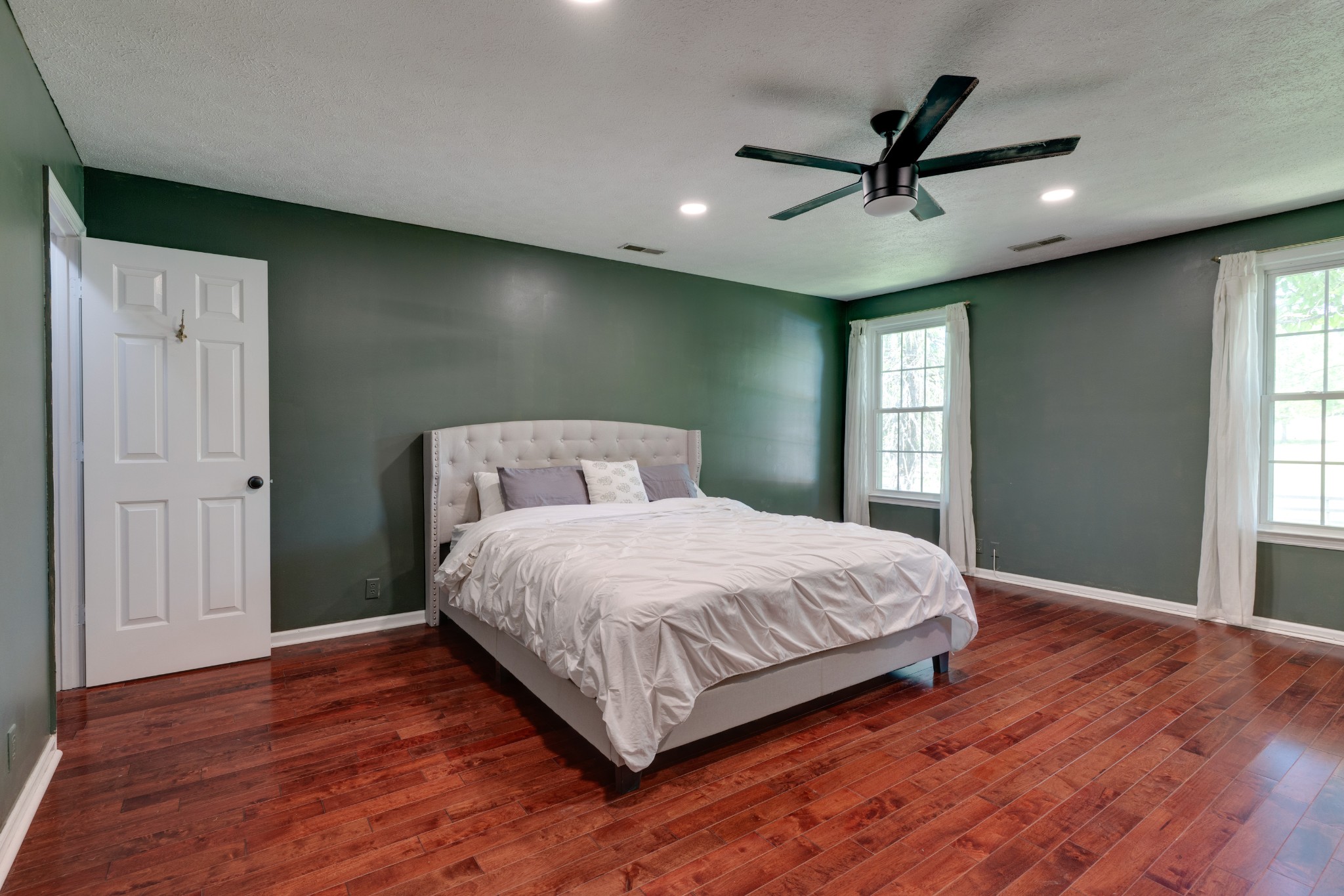 1199 Willis Branch Road Goodlettsville, TN 37072 - Photo 69 of 95 a bedroom with a large bed chandelier and a window