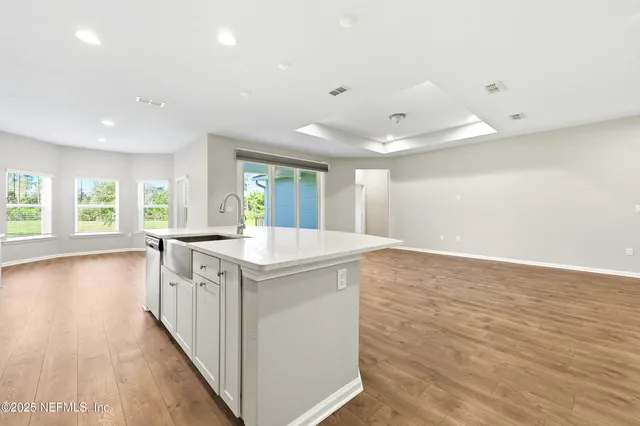 a kitchen with a sink and cabinets