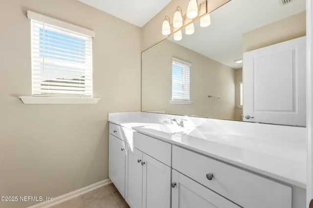 a white toilet sitting next to a bath tub