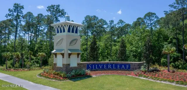 an aerial view of a house a swimming pool outdoor seating and outdoor space