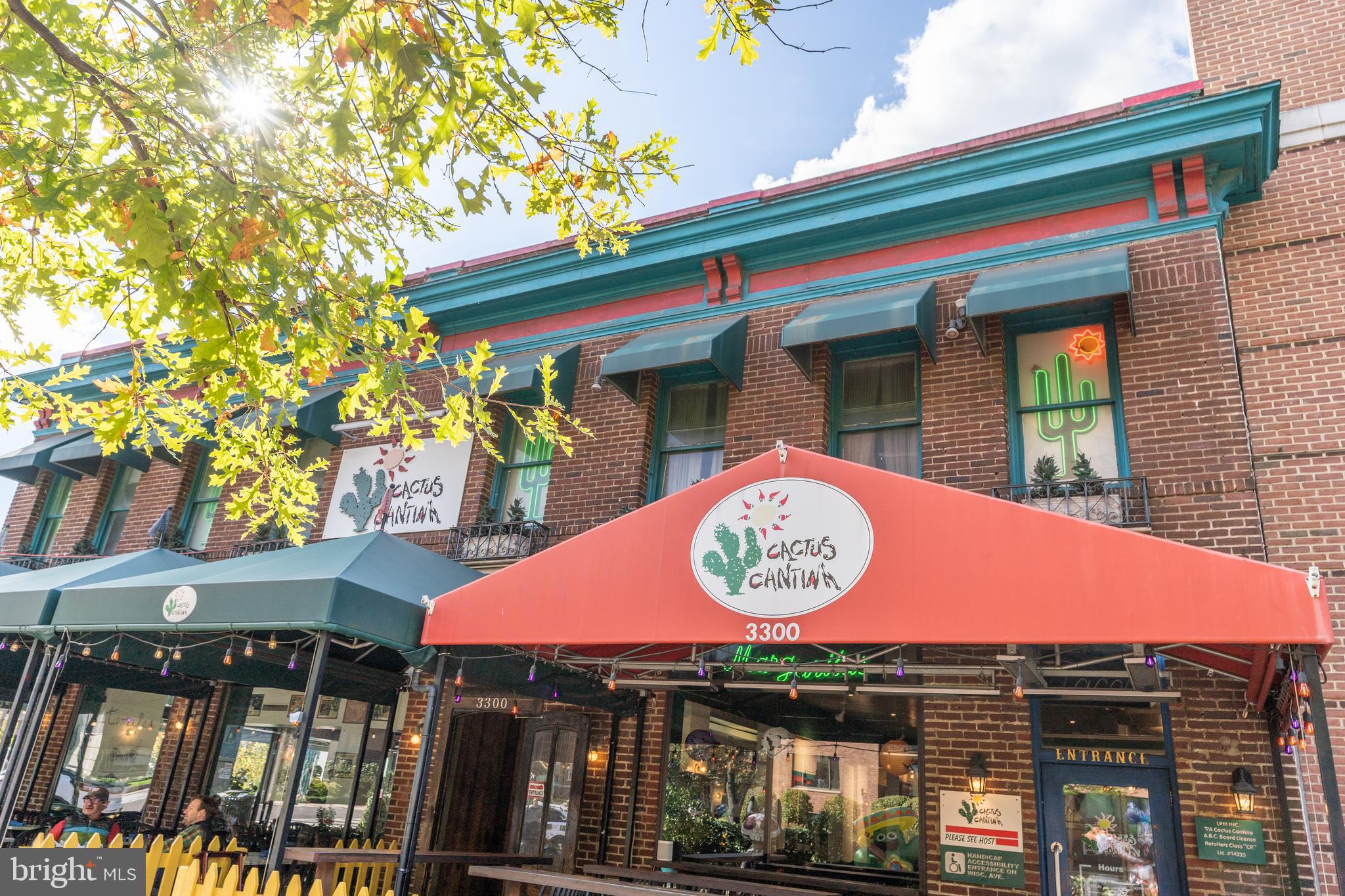 3806 Porter Street Northwest, Unit 101 Washington, DC 20016 - Photo 27 of 31 a view of a cafe with table and chairs