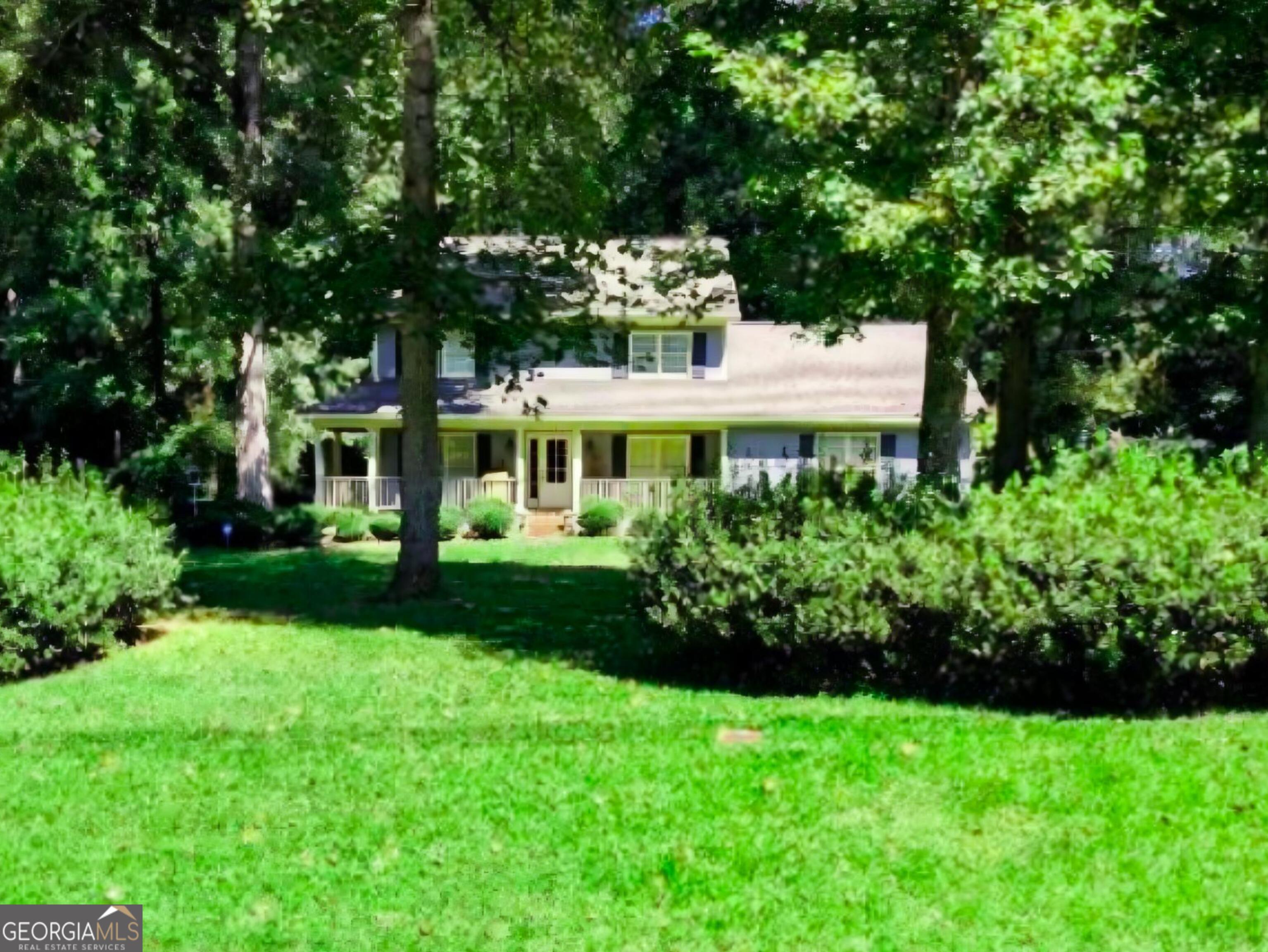 6111 Peake Road Macon, GA 31220 - Photo 1 of 21 a front view of a house with a yard