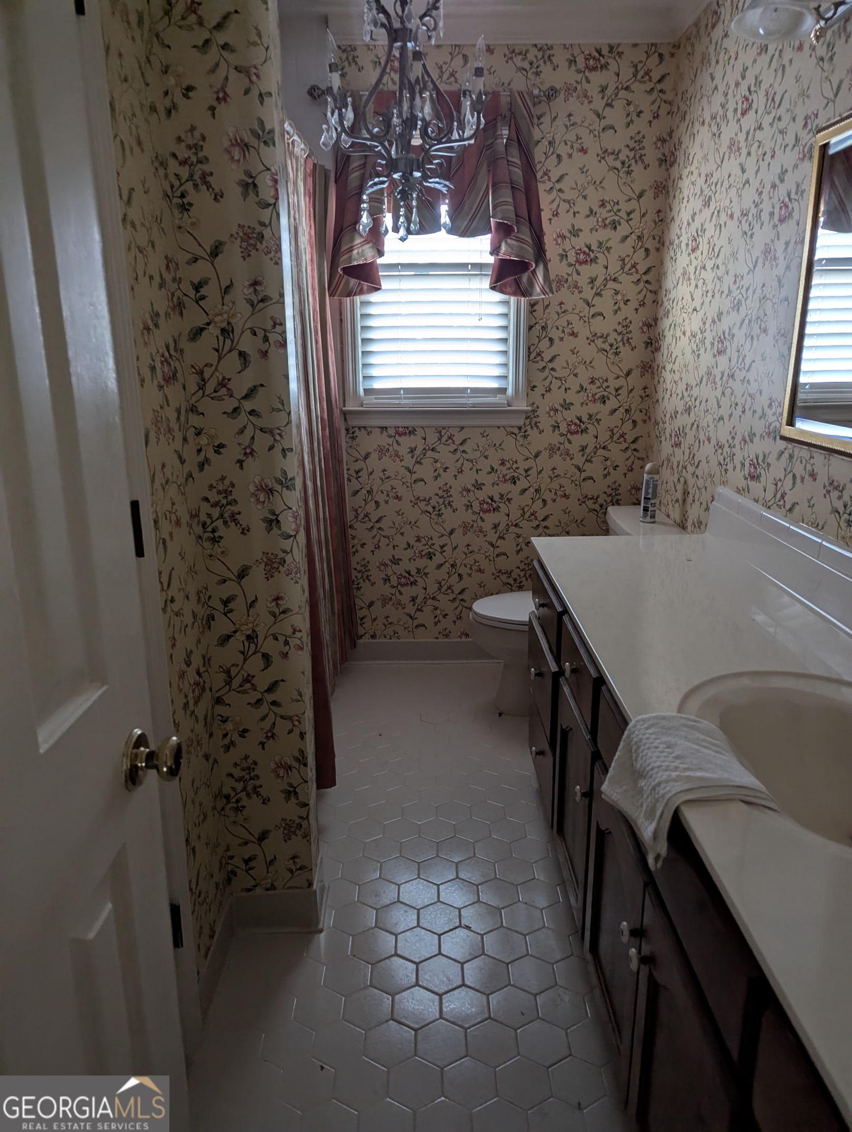 6111 Peake Road Macon, GA 31220 - Photo 11 of 21 a bathroom with a sink a toilet and window