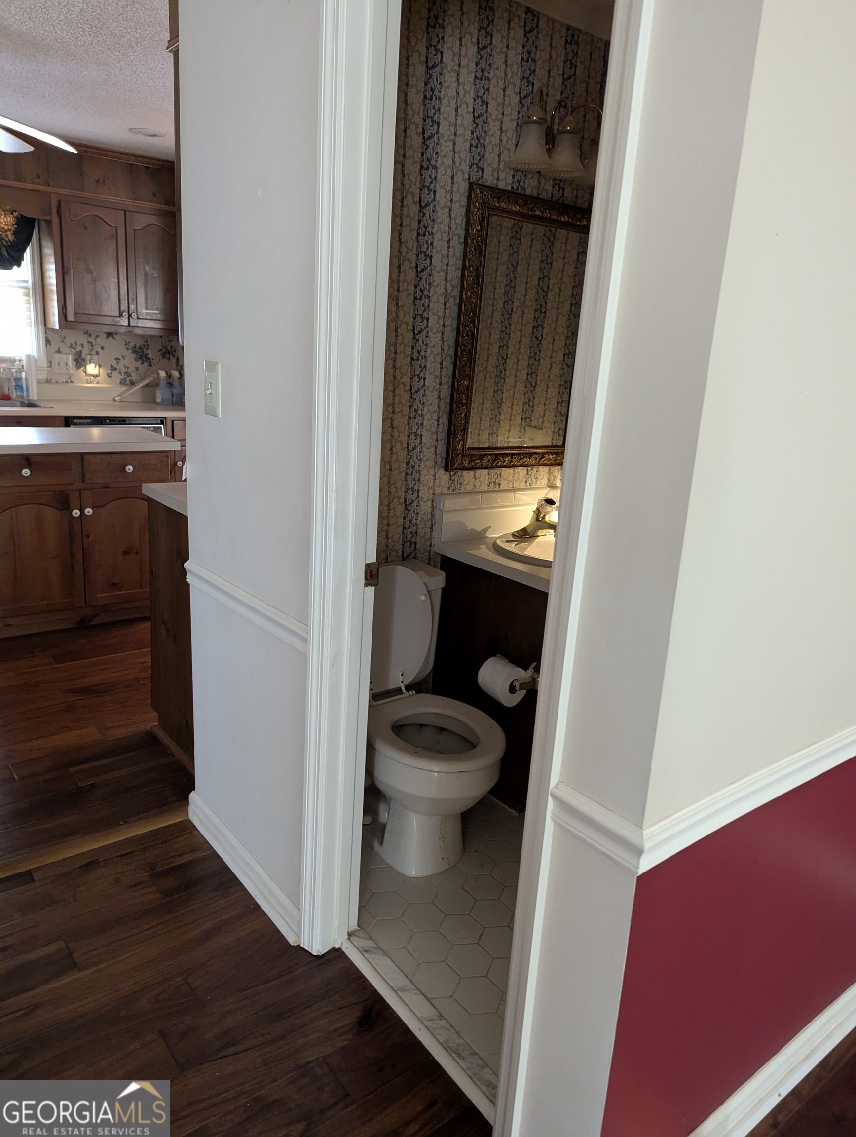 6111 Peake Road Macon, GA 31220 - Photo 16 of 21 a bathroom with a granite countertop sink and a toilet