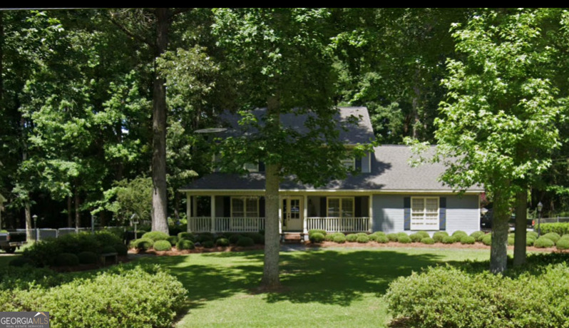 6111 Peake Road Macon, GA 31220 - Photo 18 of 21 a front view of a house with a garden