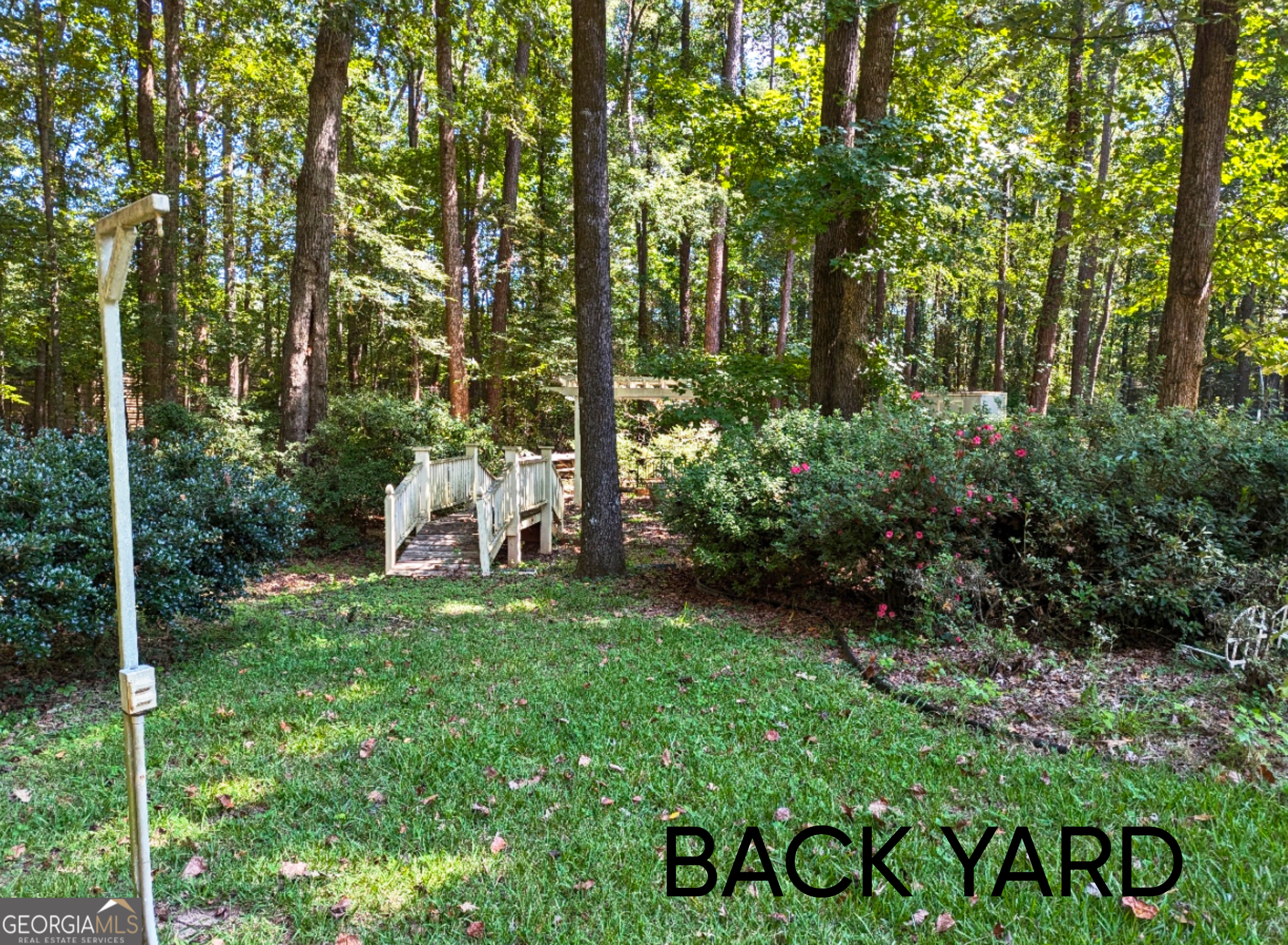 6111 Peake Road Macon, GA 31220 - Photo 20 of 21 a view of a table and chairs in the garden