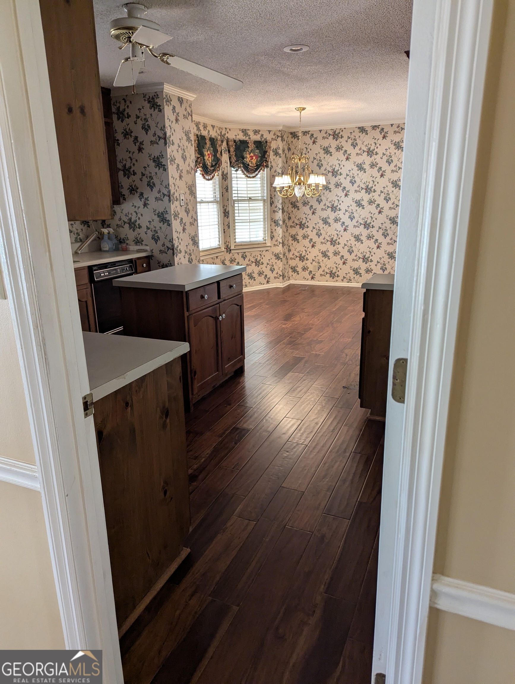 6111 Peake Road Macon, GA 31220 - Photo 3 of 21 a view of a hallway and wooden floor