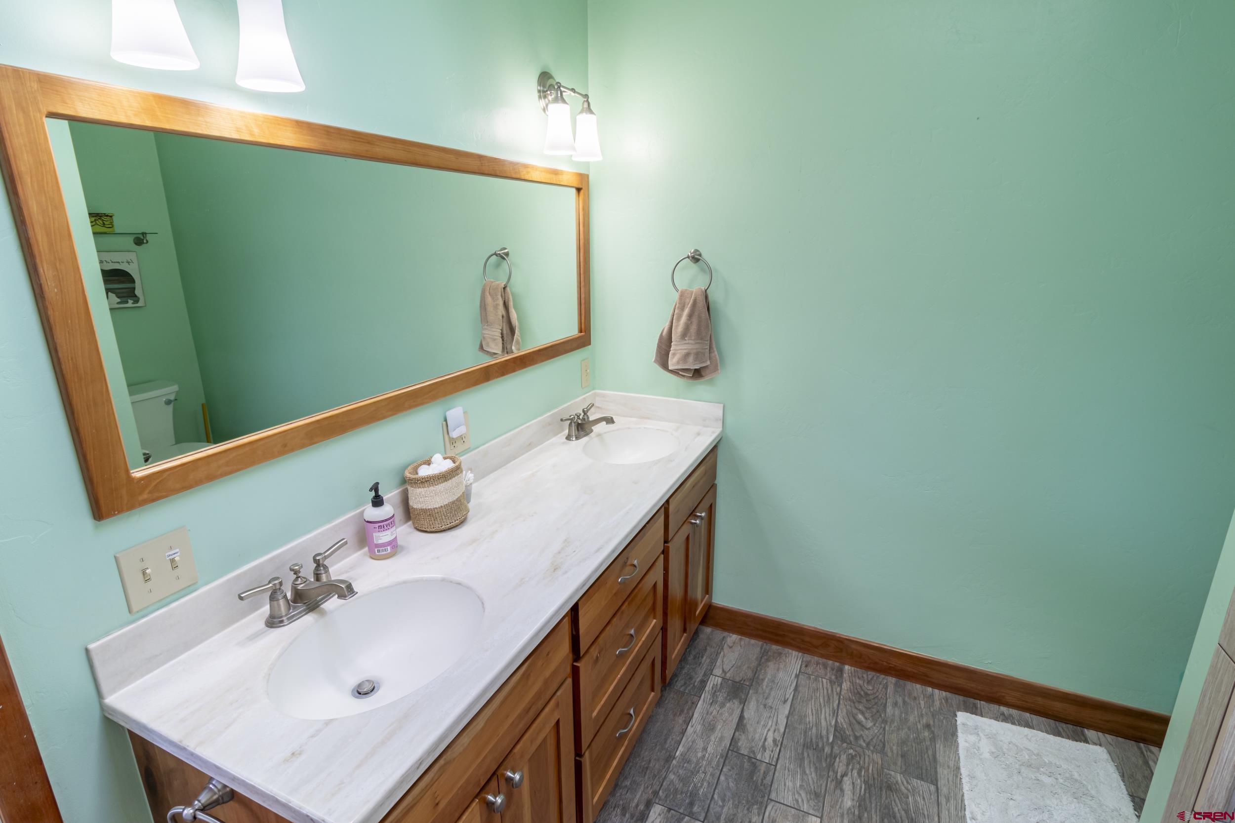 198 Spring Creek Drive Durango, CO 81301 - Photo 13 of 39 a bathroom with a sink and a mirror