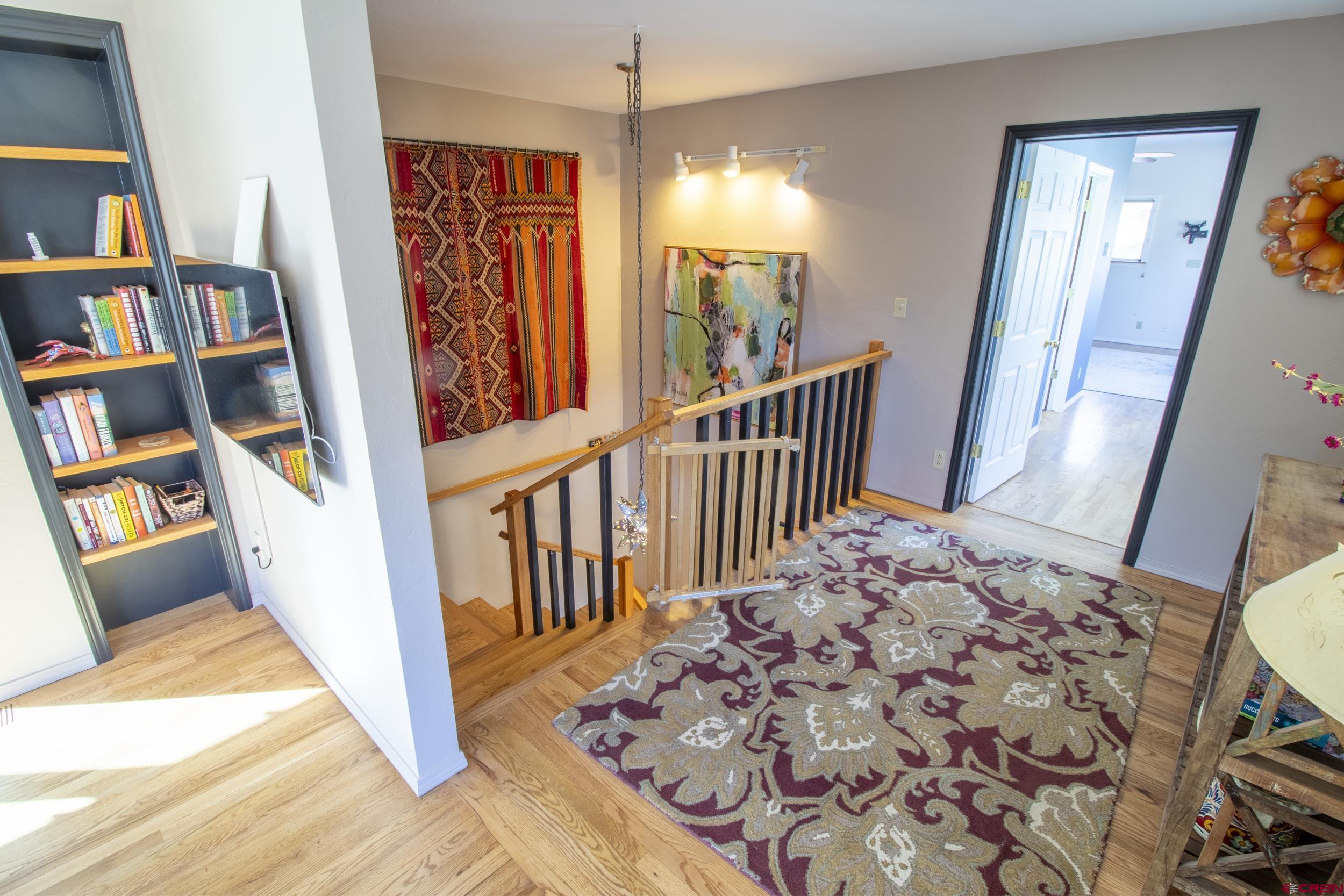 198 Spring Creek Drive Durango, CO 81301 - Photo 15 of 39 a view of a hallway with wooden floor and entryway