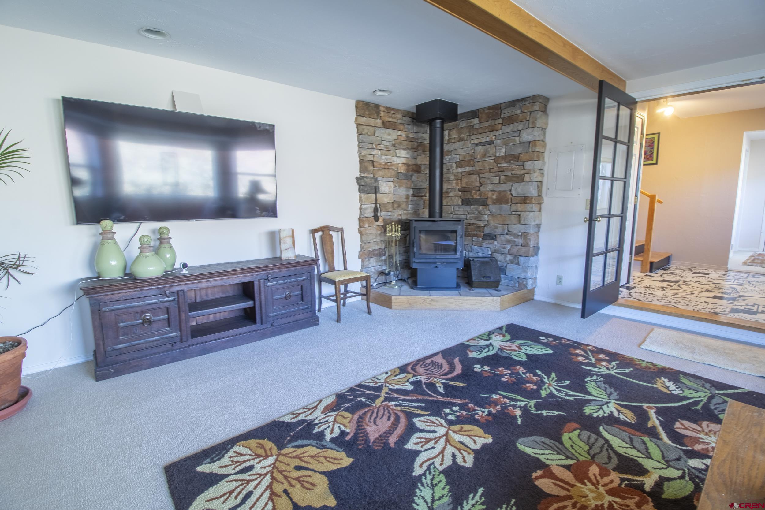 198 Spring Creek Drive Durango, CO 81301 - Photo 18 of 39 a living room with furniture and a fireplace