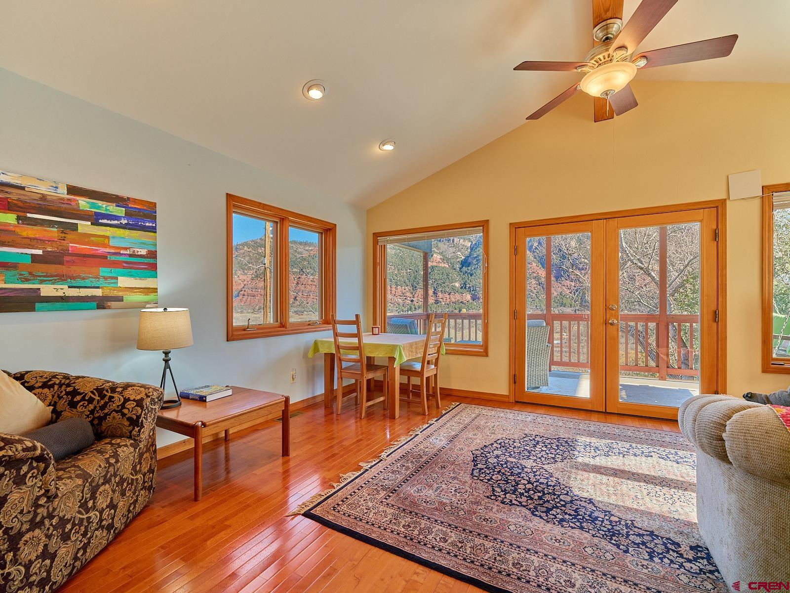 198 Spring Creek Drive Durango, CO 81301 - Photo 32 of 39 a living room with furniture and a rug