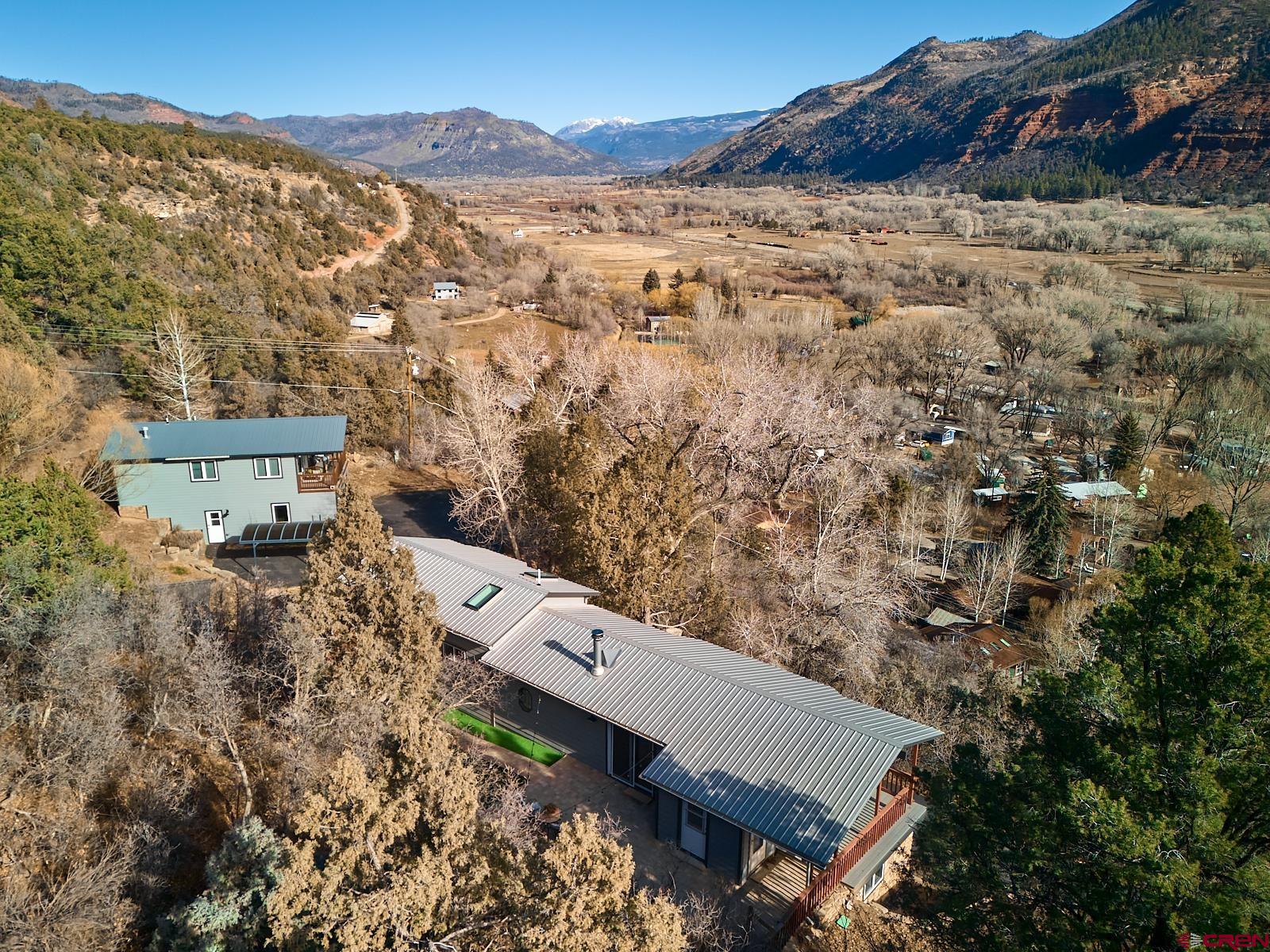 198 Spring Creek Drive Durango, CO 81301 - Photo 4 of 39 a view of a houses with a yard