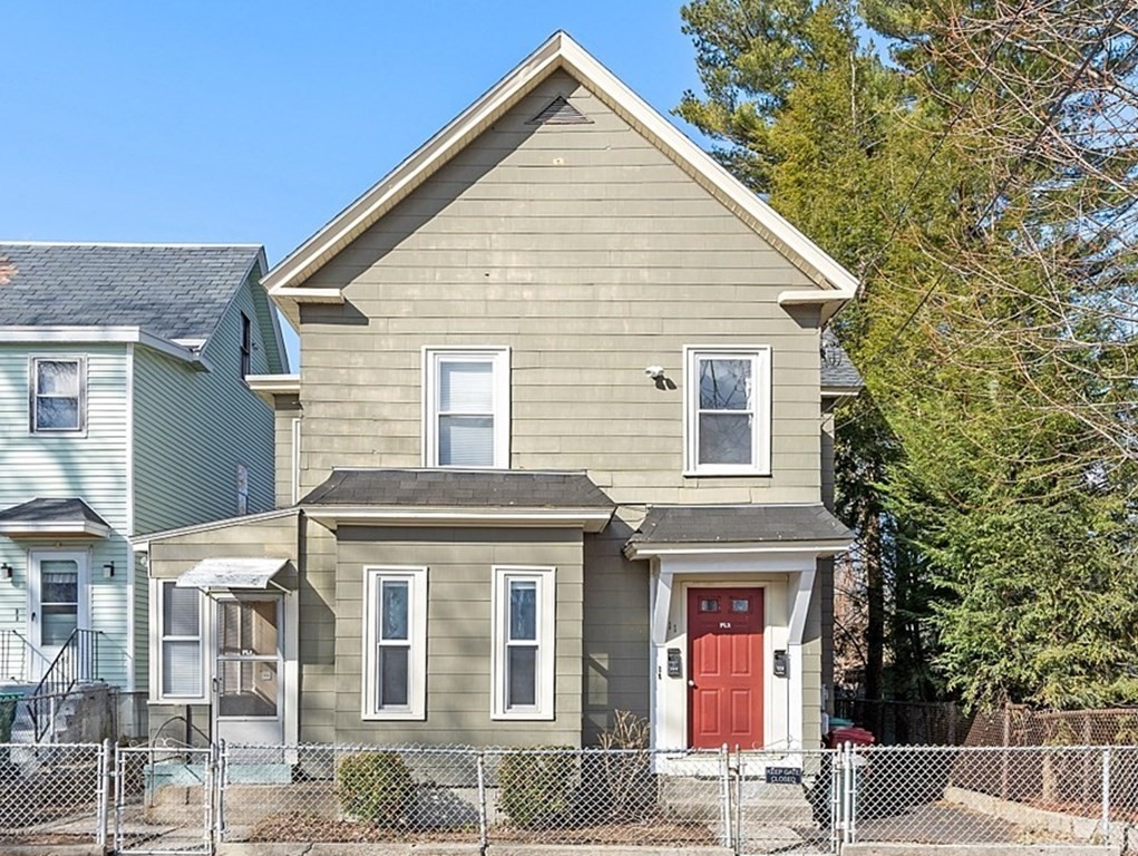 11 Autumn Street Lowell, MA 01852 - Photo 1 of 35 a view of a house with a yard and potted plants