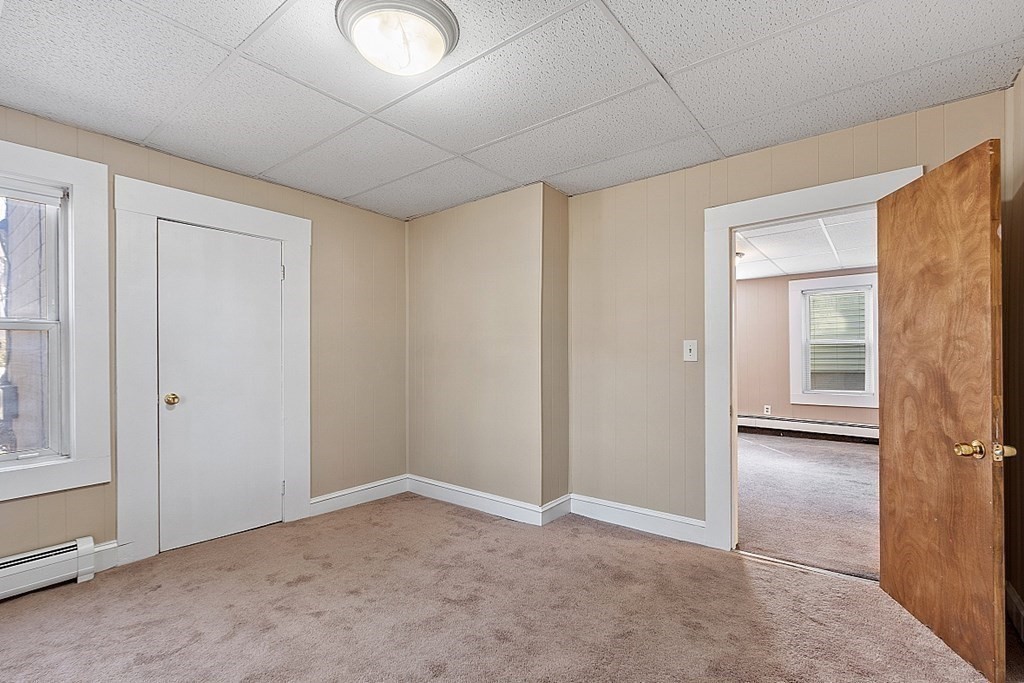 11 Autumn Street Lowell, MA 01852 - Photo 11 of 35 an empty room with windows and closet