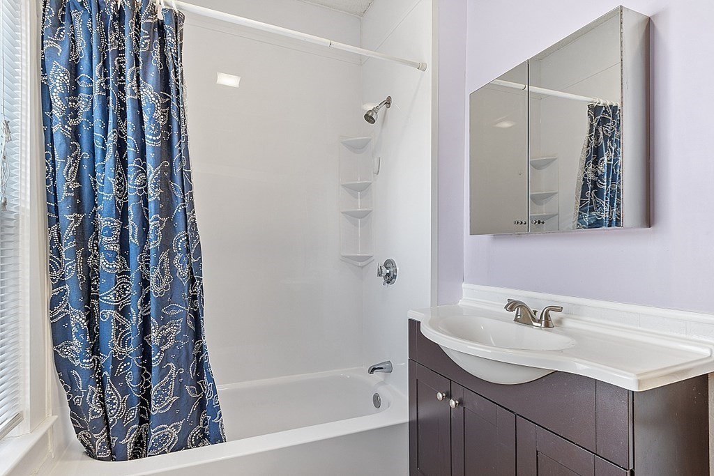 11 Autumn Street Lowell, MA 01852 - Photo 20 of 35 a bathroom with a bathtub and a sink