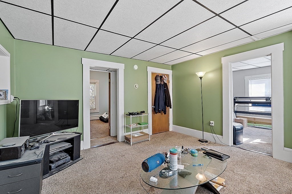 11 Autumn Street Lowell, MA 01852 - Photo 22 of 35 a living room with furniture and a flat screen tv