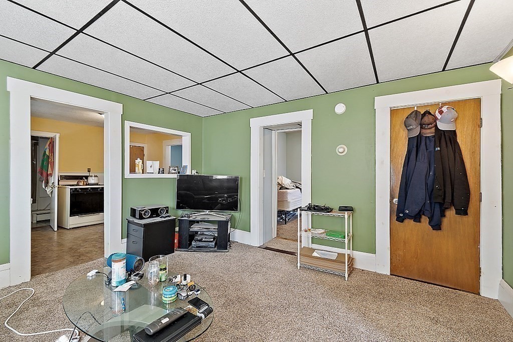 11 Autumn Street Lowell, MA 01852 - Photo 23 of 35 a room with furniture and a flat screen tv