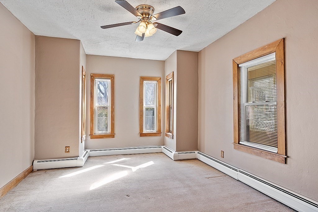 11 Autumn Street Lowell, MA 01852 - Photo 8 of 35 an empty room with windows and fan