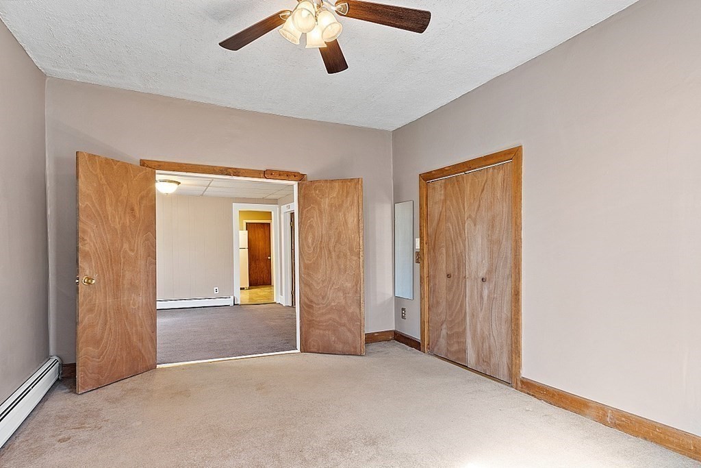 11 Autumn Street Lowell, MA 01852 - Photo 9 of 35 an empty room with windows and closet
