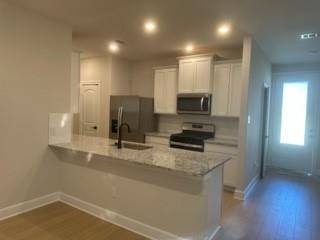 1201 Witherspoon Lane Princeton, TX 75407 - Photo 5 of 15 a kitchen with a sink appliances and cabinets
