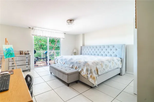 a bedroom with a bed and a couch