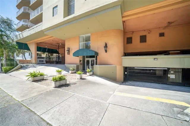 a front view of a building with sitting area