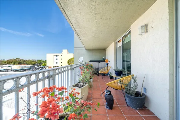 a view of two chairs in the balcony