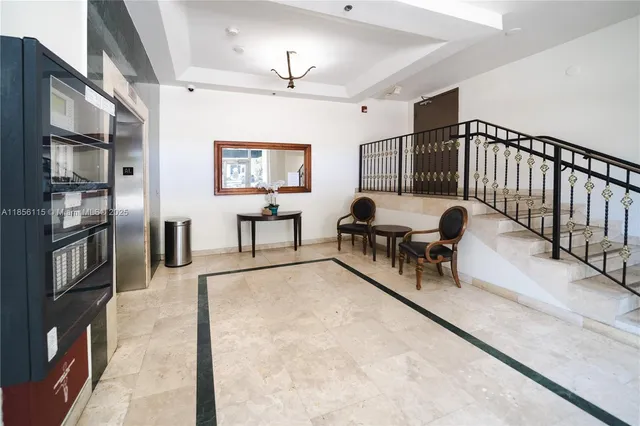 a view of a livingroom with furniture and a ceiling fan