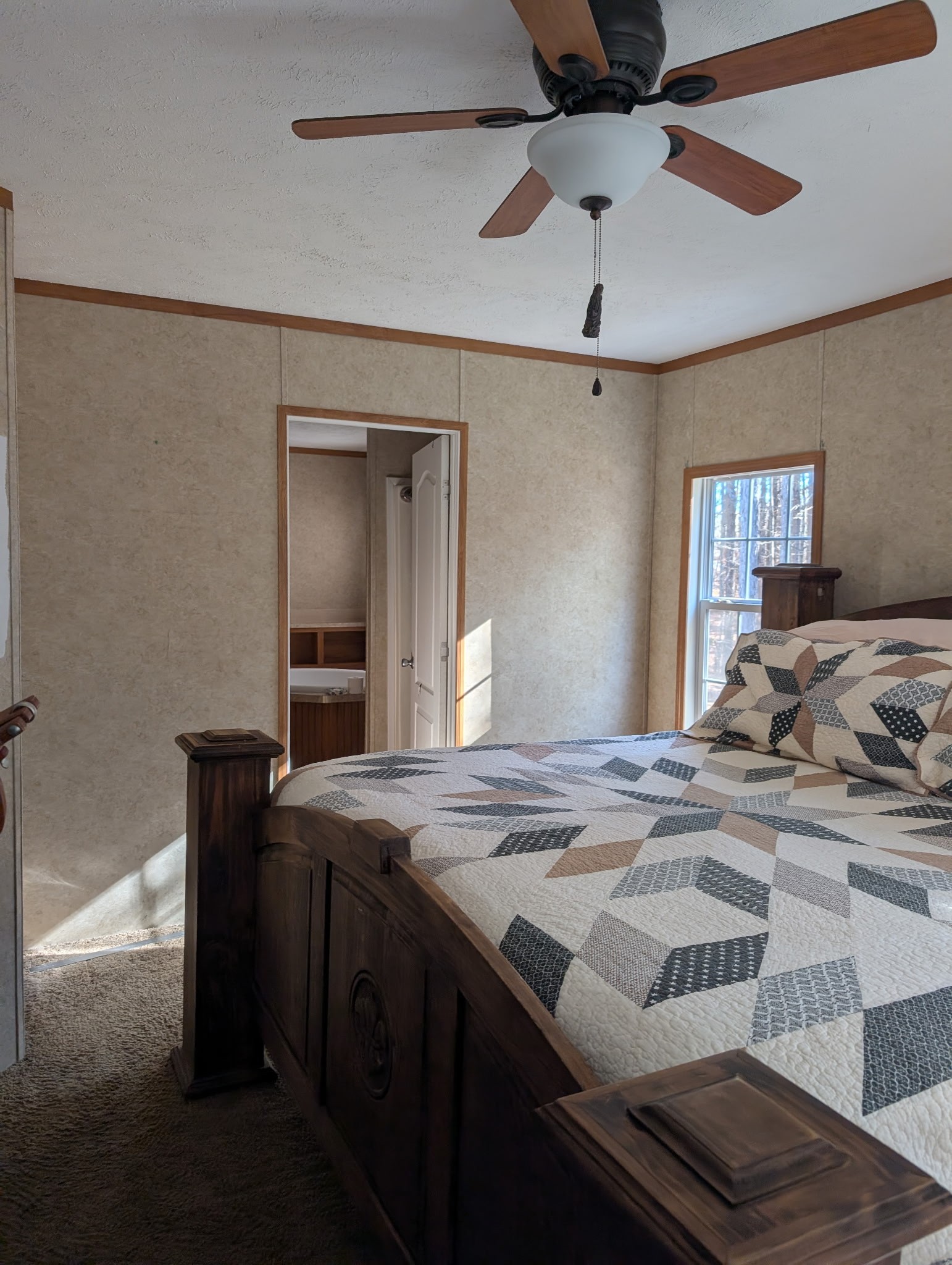 1239 Bald Knob Road Holladay, TN 38341 - Photo 17 of 25 a bedroom with a bed and a chandelier