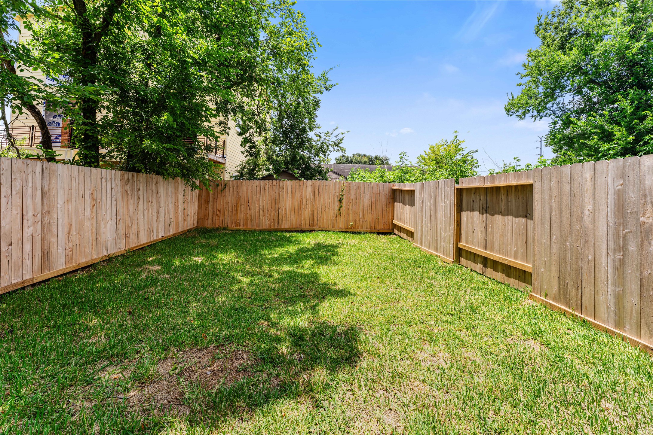 3620 Mt Pleasant Street, Unit A Houston, TX 77021 - Photo 21 of 23 a view of backyard with potted plants and wooden fence