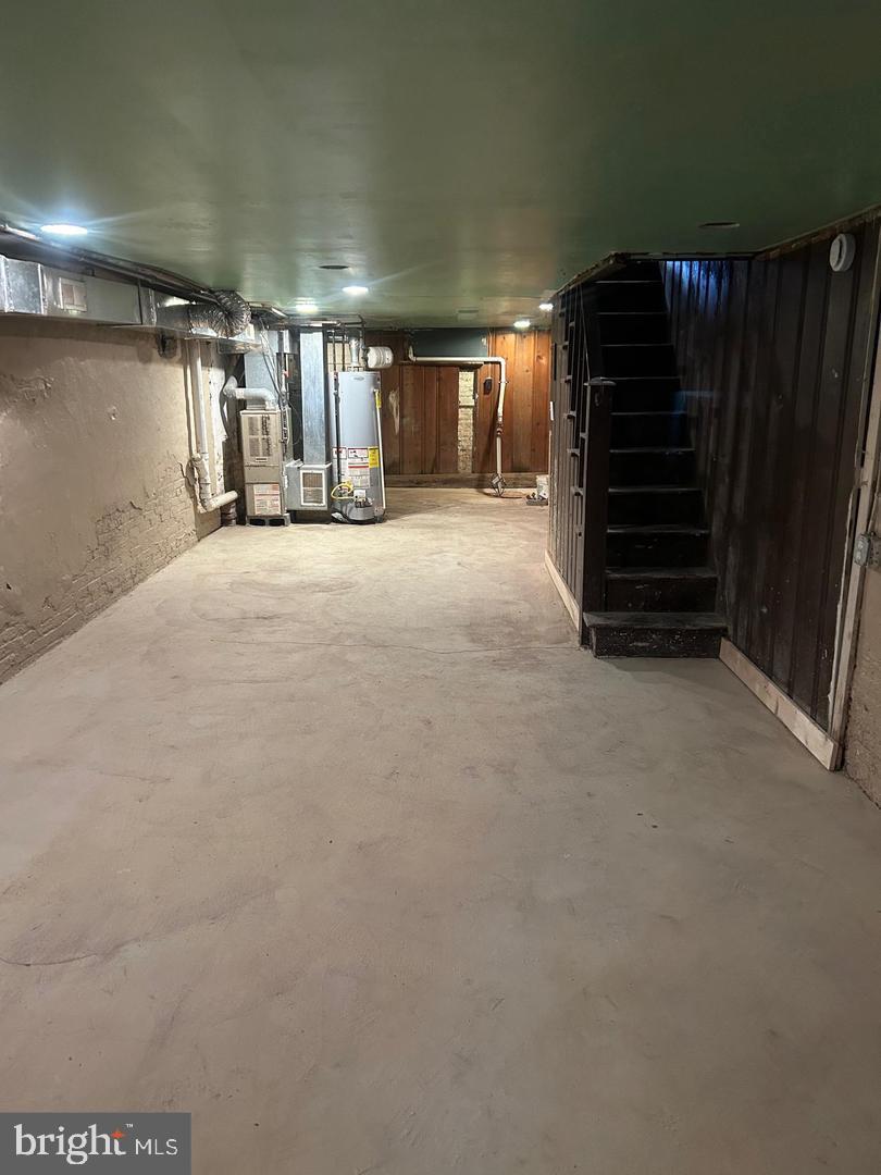 1633 Normal Avenue Baltimore, MD 21213 - Photo 13 of 15 Spacious basement ready for your vision.