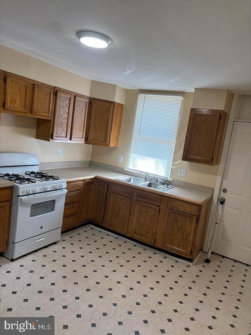 1633 Normal Avenue Baltimore, MD 21213 - Photo 7 of 15 Bright and inviting kitchen with ample storage.