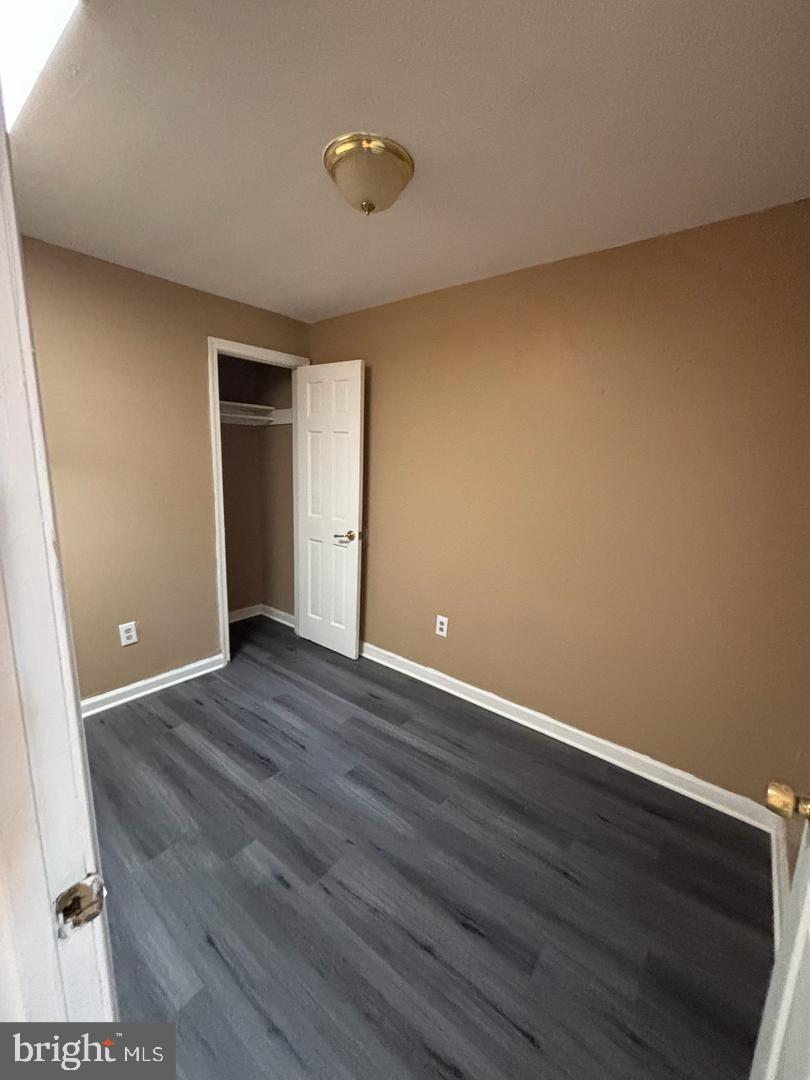 1633 Normal Avenue Baltimore, MD 21213 - Photo 10 of 15 Cozy room with warm tones and sleek flooring.