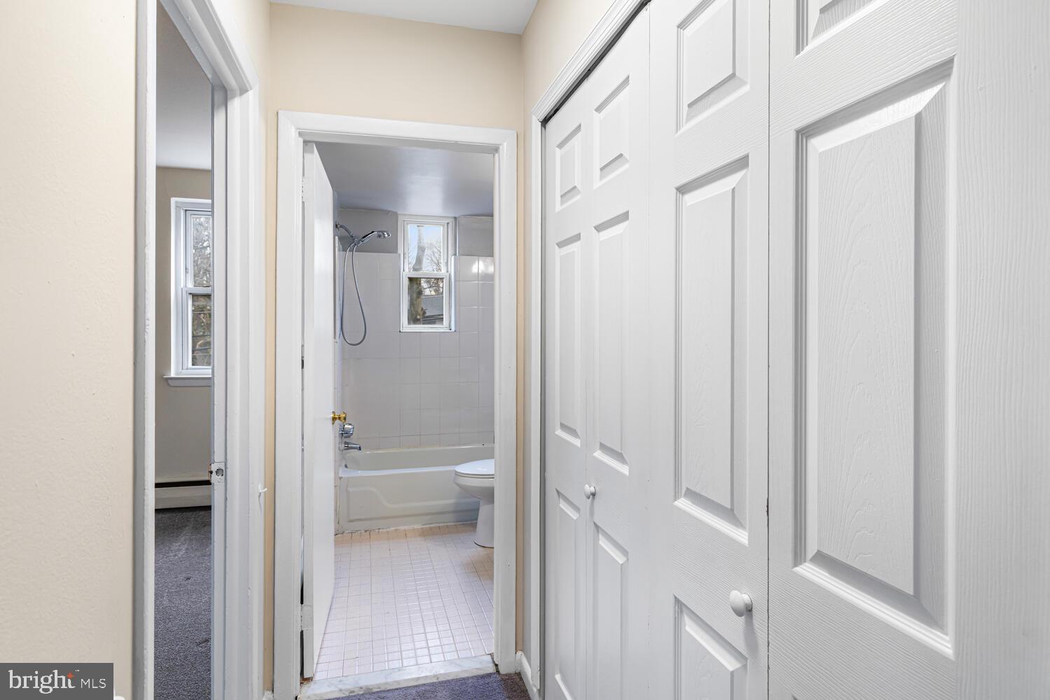 1600 Church Road, Unit D205 Wyncote, PA 19095 - Photo 12 of 21 a view of a bathroom from a hallway with toilet