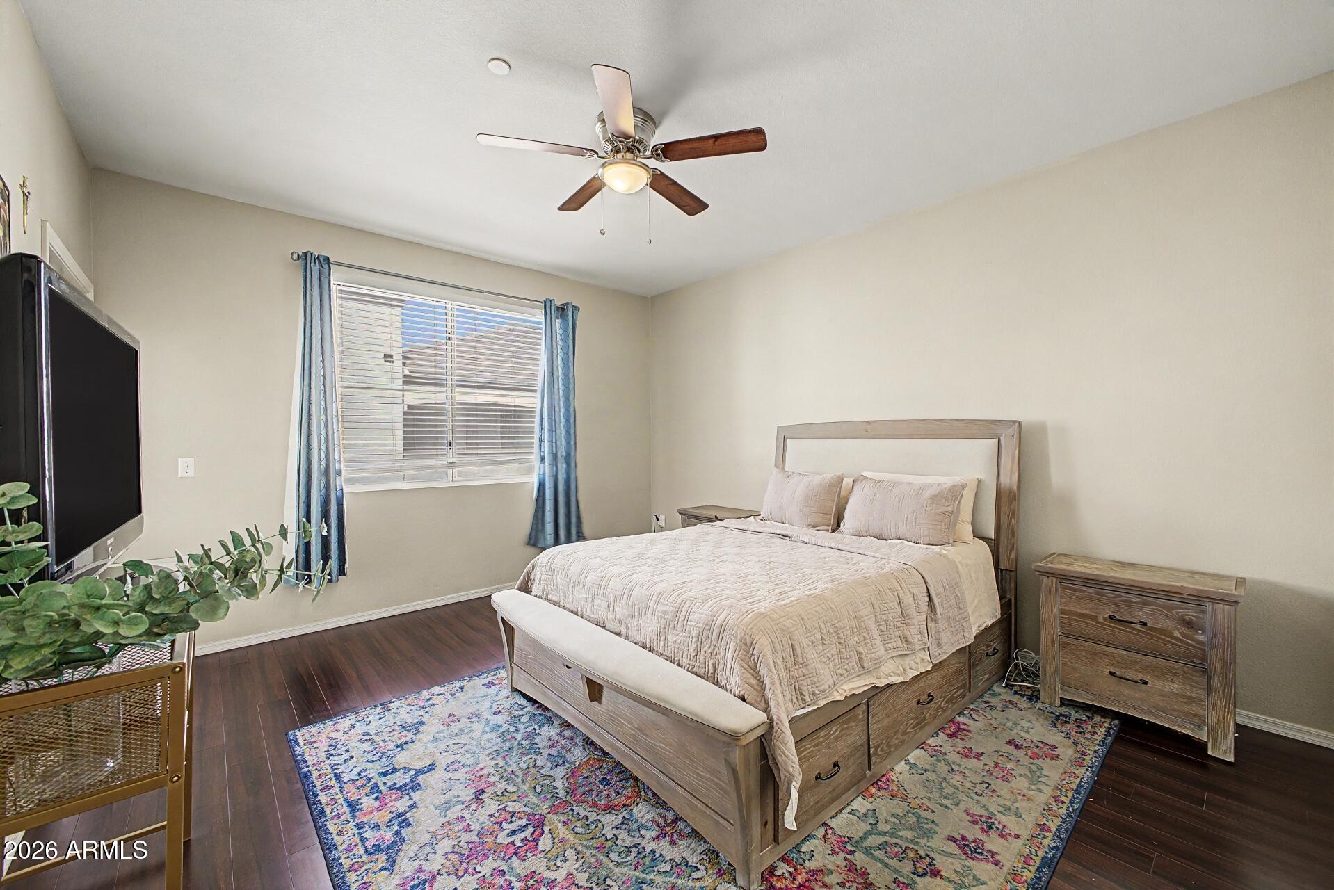 3302 North 7th Street, Unit 354 Phoenix, AZ 85014 - Photo 14 of 32 a bedroom with a large bed and a window
