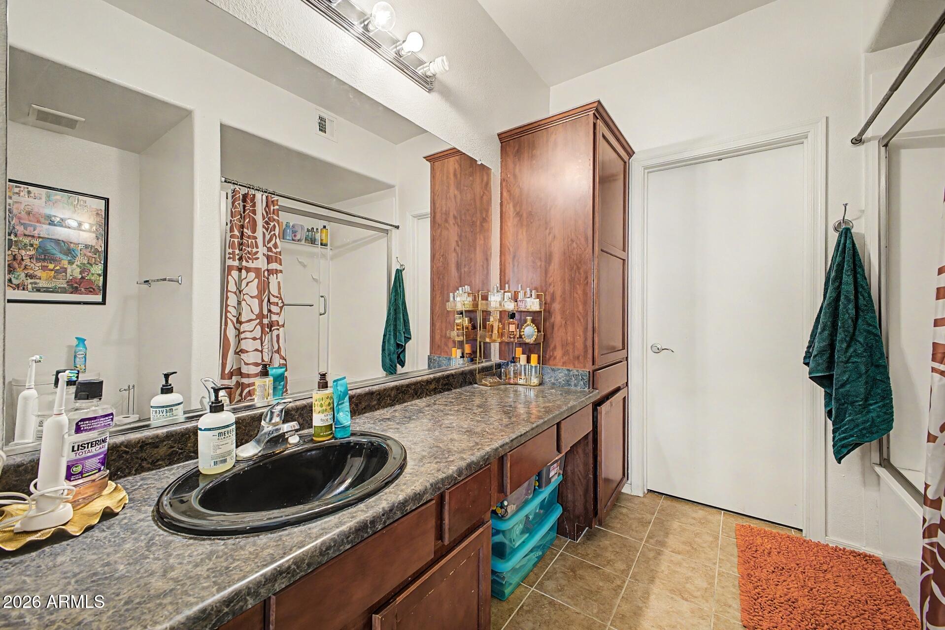 3302 North 7th Street, Unit 354 Phoenix, AZ 85014 - Photo 15 of 32 a bathroom with a sink and a mirror