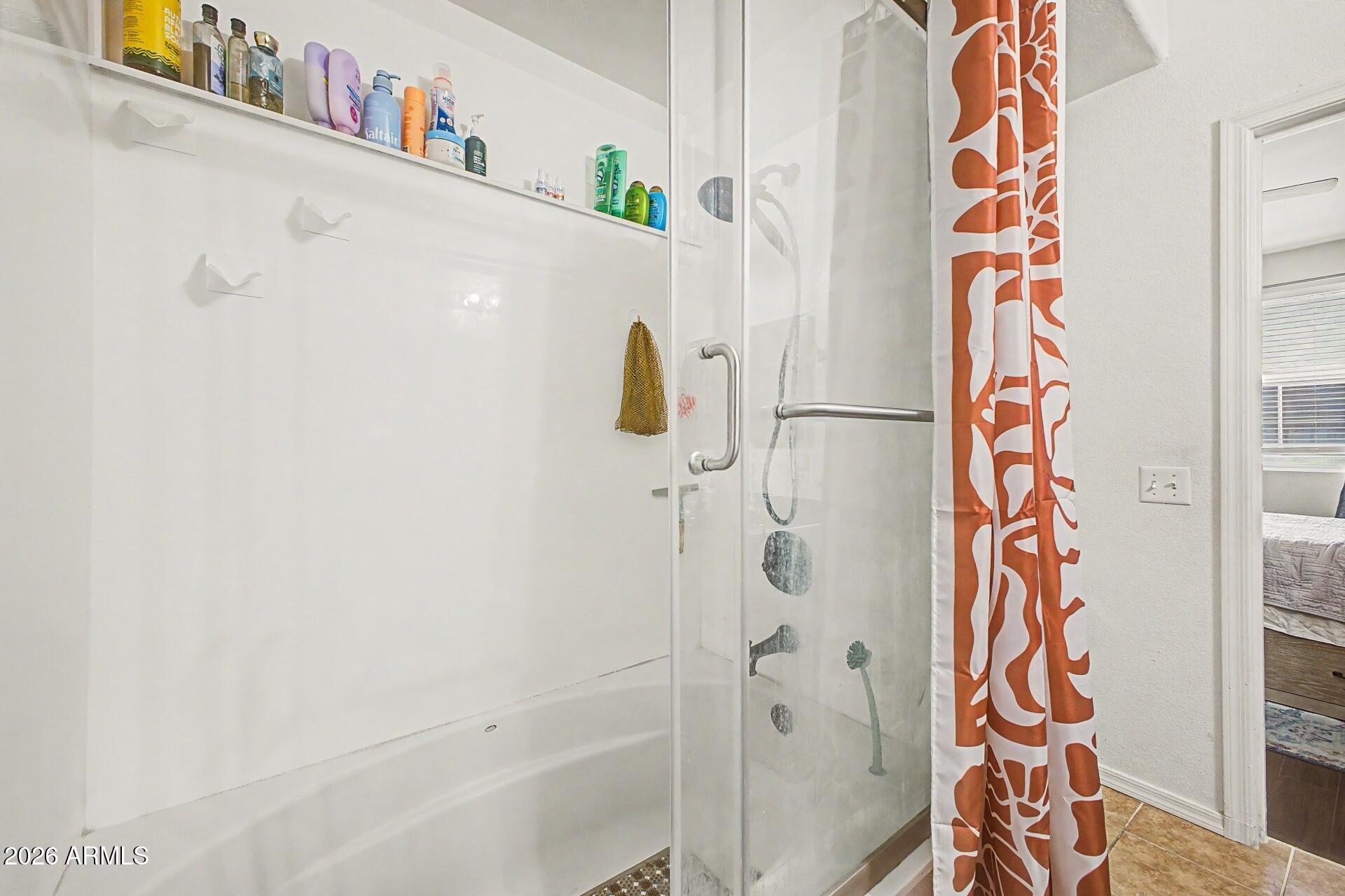 3302 North 7th Street, Unit 354 Phoenix, AZ 85014 - Photo 16 of 32 a bathroom with a bathtub and shower