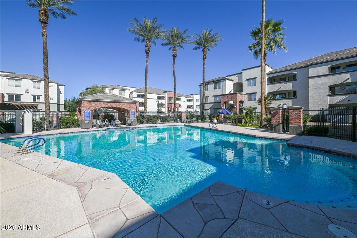 3302 North 7th Street, Unit 354 Phoenix, AZ 85014 - Photo 21 of 32 a view of a swimming pool with a chair