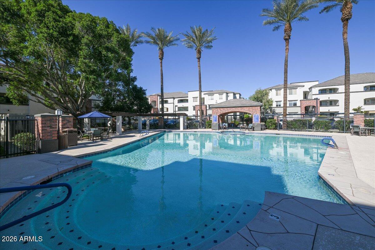 3302 North 7th Street, Unit 354 Phoenix, AZ 85014 - Photo 22 of 32 a view of a lake with a house