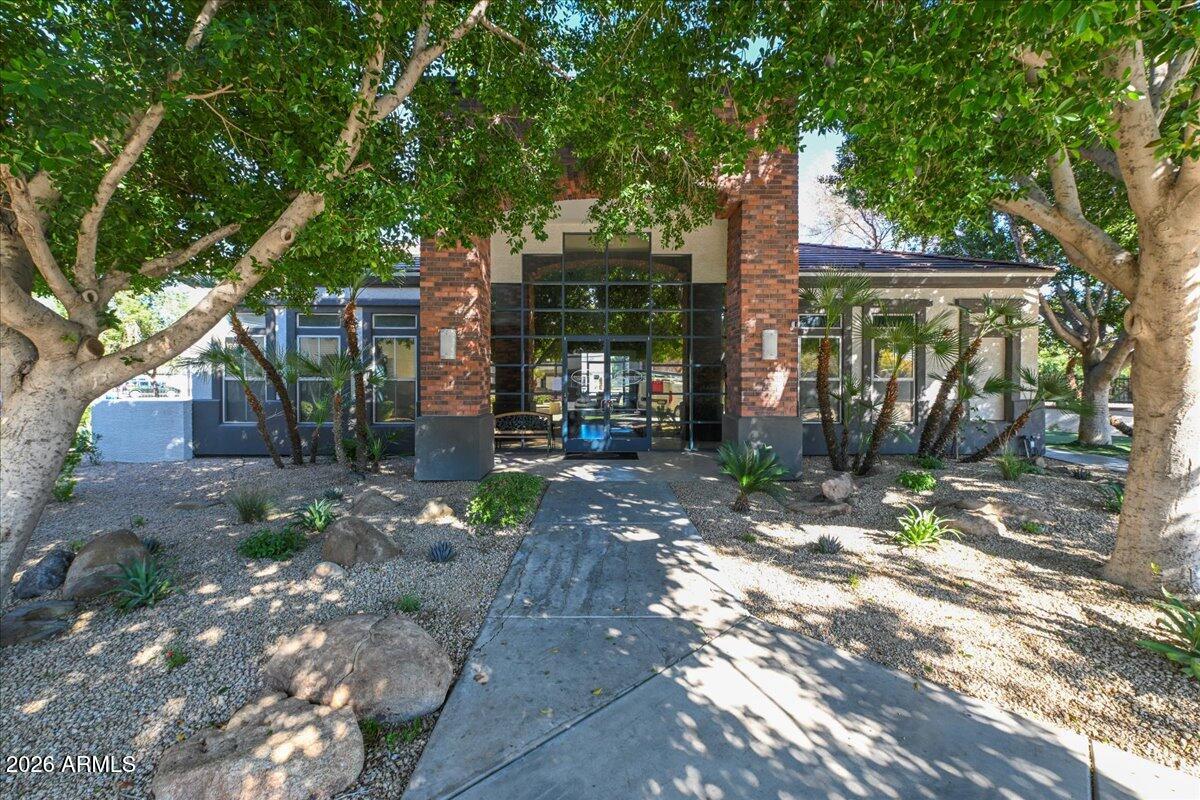 3302 North 7th Street, Unit 354 Phoenix, AZ 85014 - Photo 24 of 32 a view of a trees and a pathway in front of a house