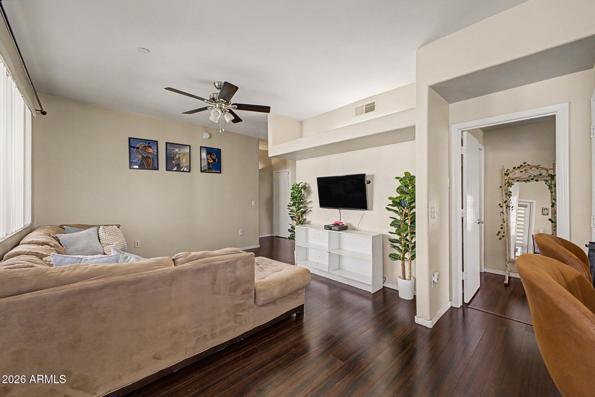 3302 North 7th Street, Unit 354 Phoenix, AZ 85014 - Photo 5 of 32 a living room with furniture and a flat screen tv